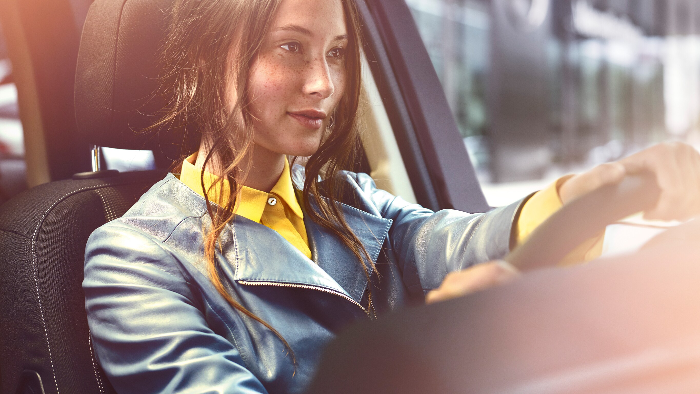 Have a safe journey with the Mercedes-Benz warranty for new vehicles. | Mercedes-Benz A relaxed man is sitting in front of his Mercedes with his tablet.